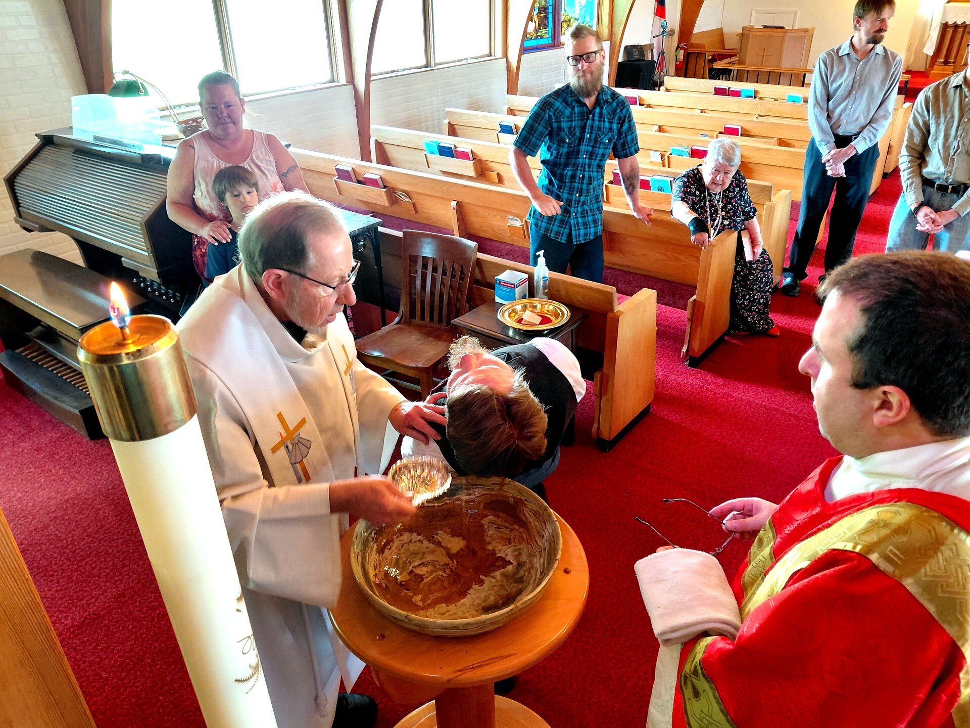 Fr. Nicholas pours the water at the font