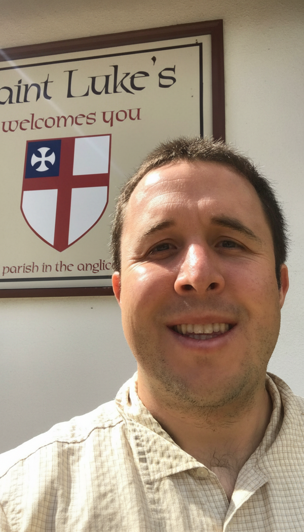 Welcoming visitor at the St. Luke's sign